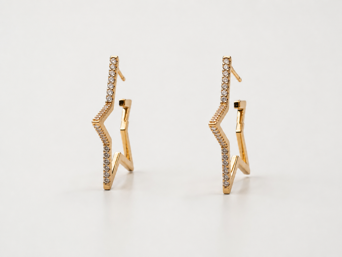 The Lucky Star Outline Hoops — Gold Plated Star Outline Hoop Earrings by House of Zena, flat lay