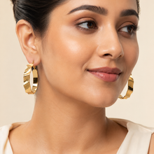 The Riviera Wave Sculpted Hoops — Gold Plated Wave Hoop Earrings by House of Zena, front view