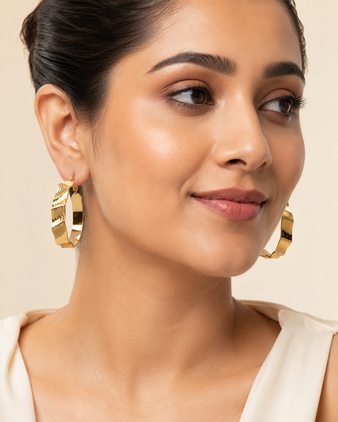 The Riviera Wave Sculpted Hoops — Gold Plated Wave Hoop Earrings by House of Zena, front view