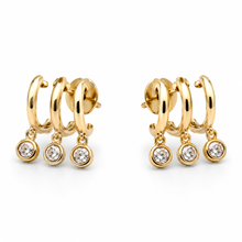 The Three Wishes Charm Hoops — Gold Plated Triple Charm Hoop Earrings by House of Zena, worn on model