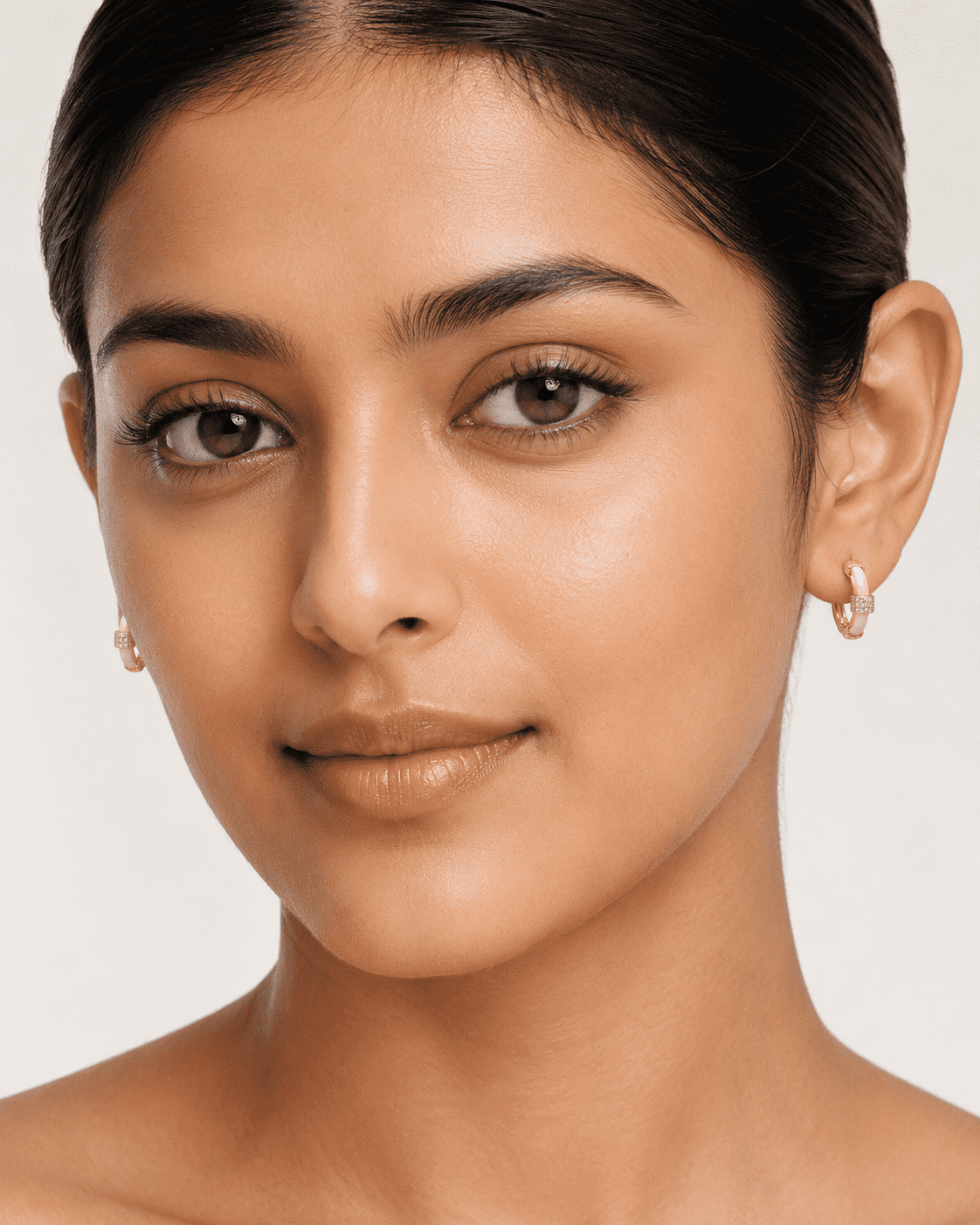 The Strawberry Milk Huggies — Gold Plated Blush Halo Huggie Earrings by House of Zena, front view