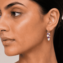 The Lavender Swirl Huggies — Gold Plated Amethyst Swirl Huggie Earrings by House of Zena, front view