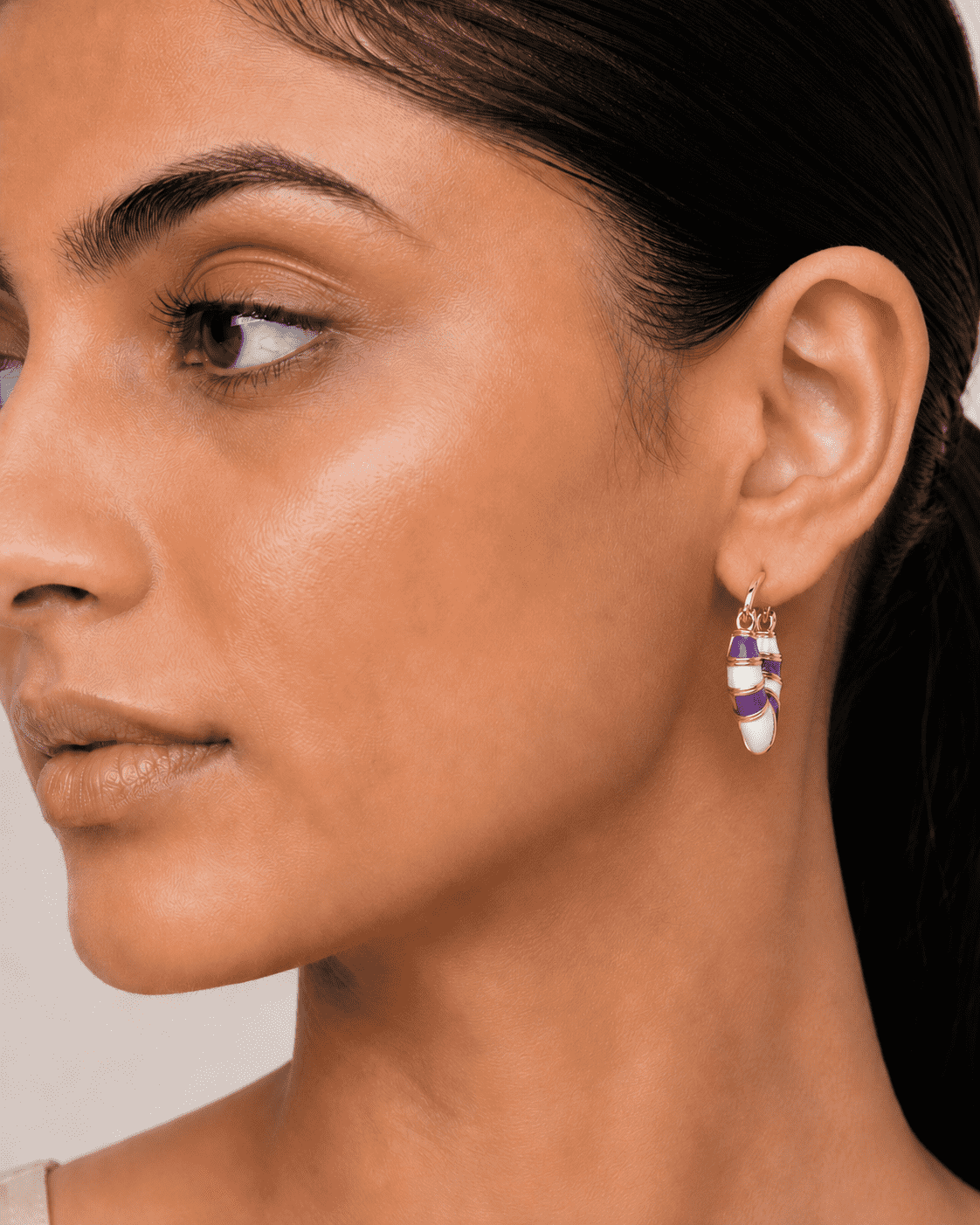 The Lavender Swirl Huggies — Gold Plated Amethyst Swirl Huggie Earrings by House of Zena, front view