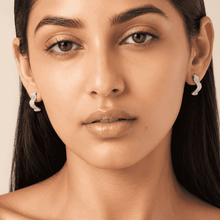 The Ocean Ripple Huggies — Silver-Tone Wave Huggie Earrings by House of Zena, front view