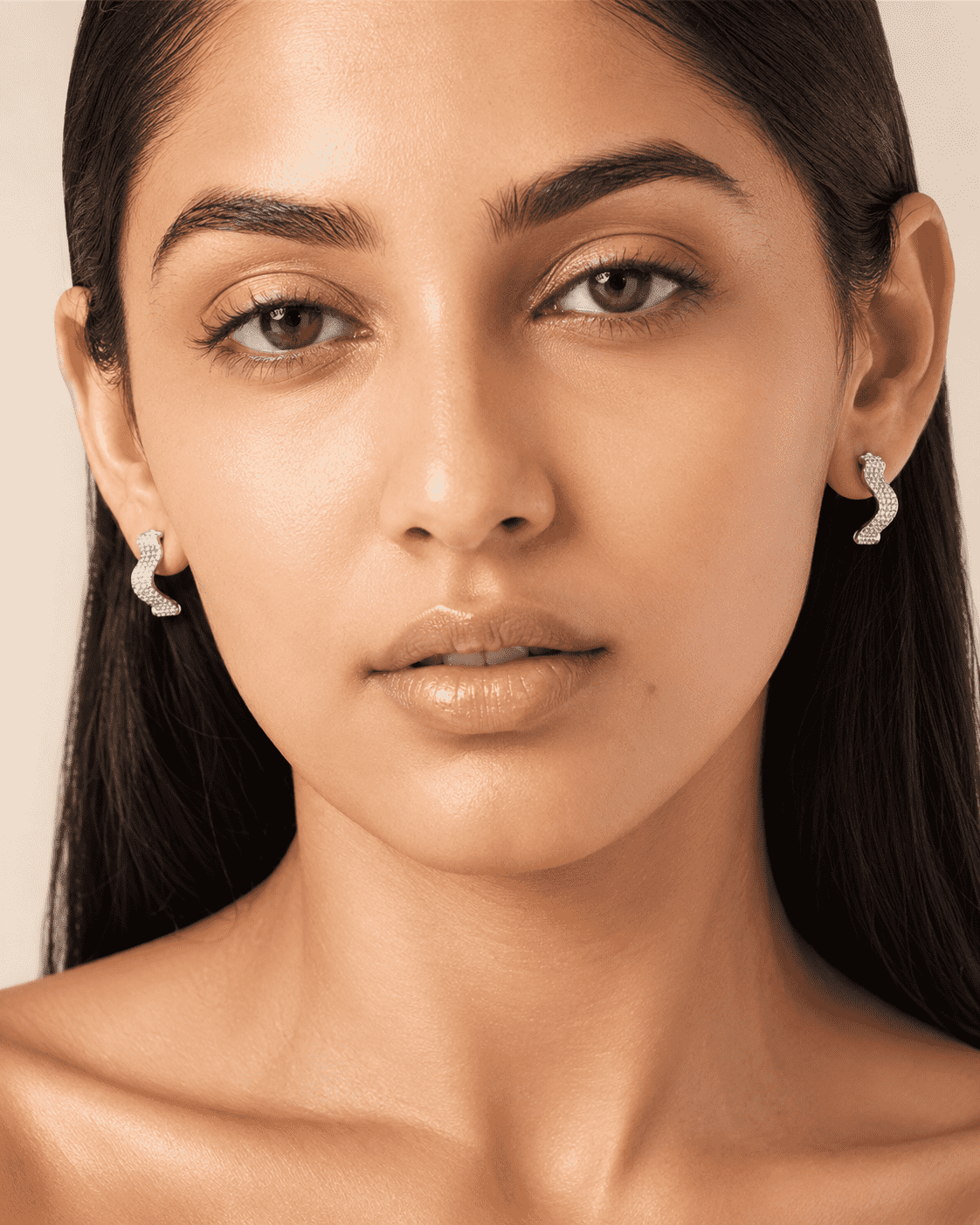 The Ocean Ripple Huggies — Silver-Tone Wave Huggie Earrings by House of Zena, front view