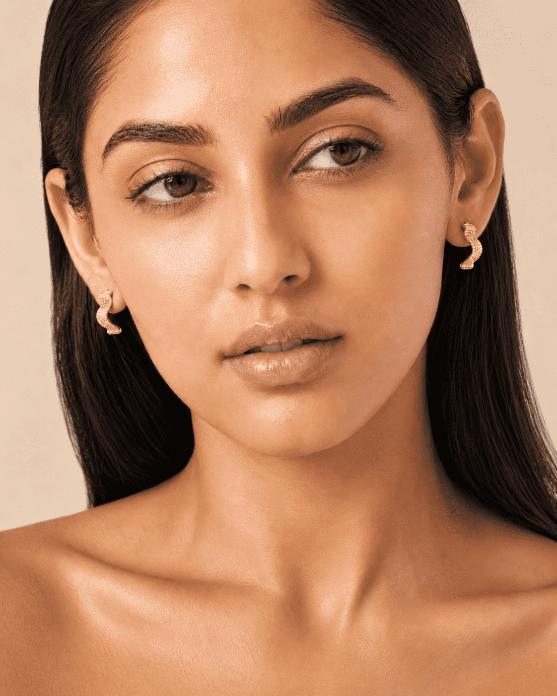 The Golden Nugget Huggies — Gold Plated Wave Crystal Huggie Earrings by House of Zena, front view