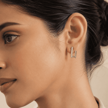 The Crisscross Pavé Illusion Hoops — Silver-Tone Dual Curve Pavé Hoop Earrings by House of Zena, front view