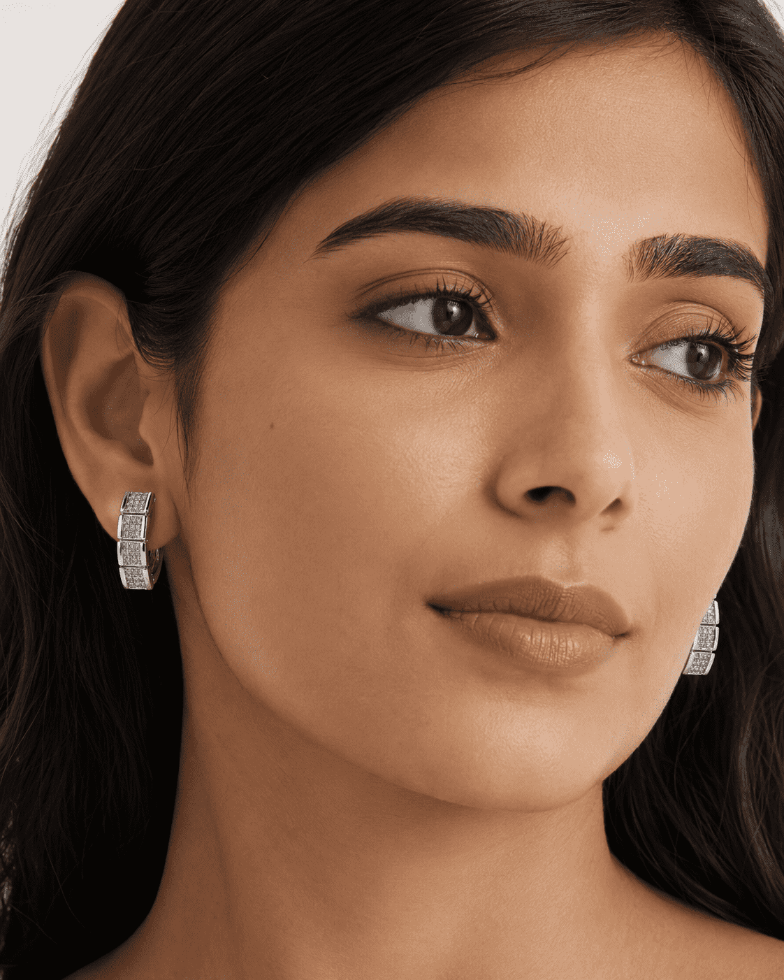 The Waffle Grid Chunky Huggies — Silver-Tone Grid Huggie Earrings by House of Zena, styled on model