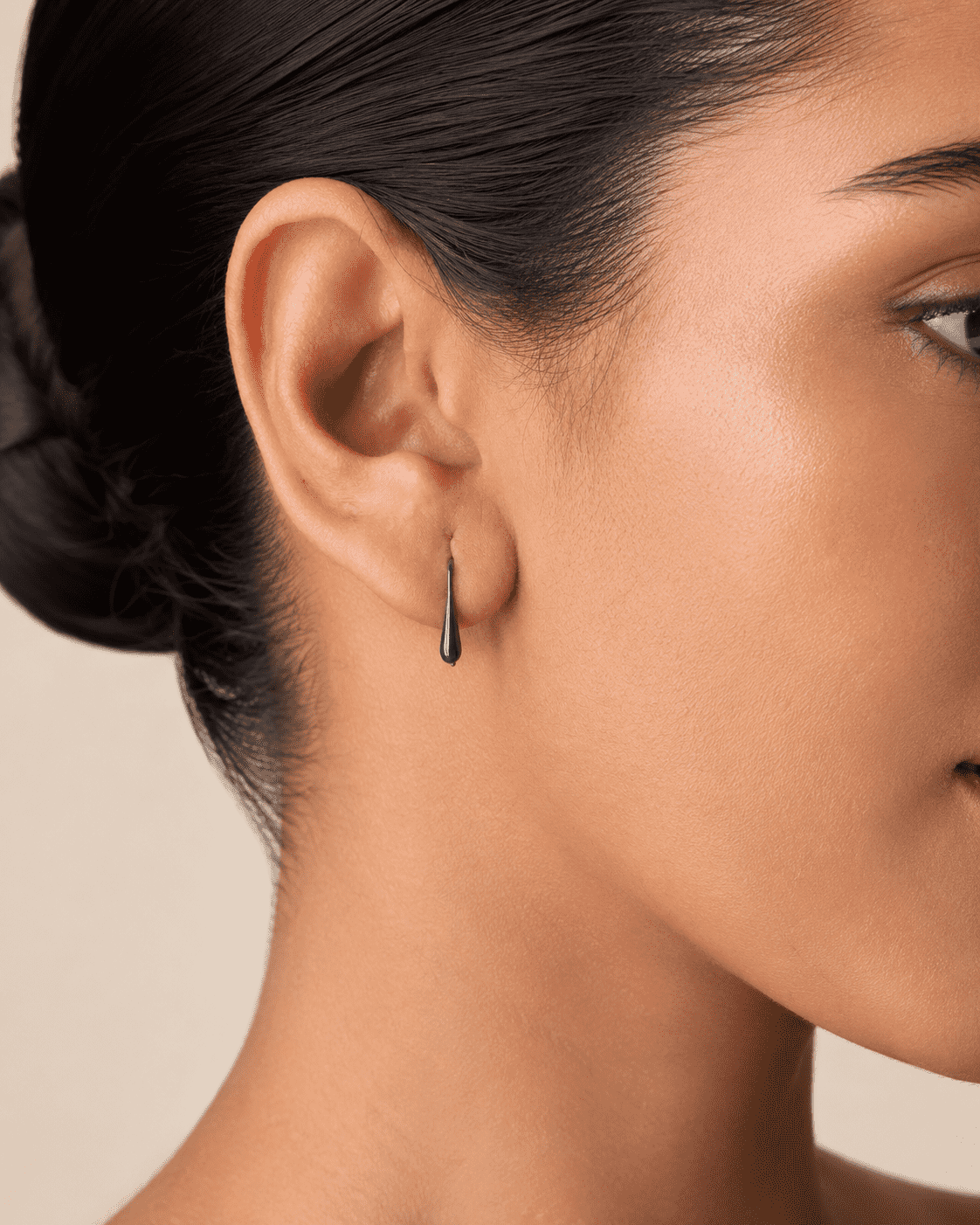 The Green Apple Mini Huggies — Gold Plated Emerald Drop Huggie Earrings by House of Zena, front view