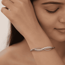 The "Forever Yours" Infinity Bangle — Silver-Tone Infinity Bangle by House of Zena, front view