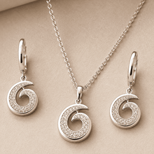The Cinnamon Roll Spiral Set — Silver-Tone Spiral Pendant Set by House of Zena, styled on model