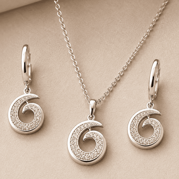 The Cinnamon Roll Spiral Set — Silver-Tone Spiral Pendant Set by House of Zena, styled on model — Anti-Tarnish Waterproof Jewellery | House of Zena