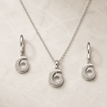 The Cinnamon Roll Spiral Set — Silver-Tone Spiral Pendant Set by House of Zena, worn on model