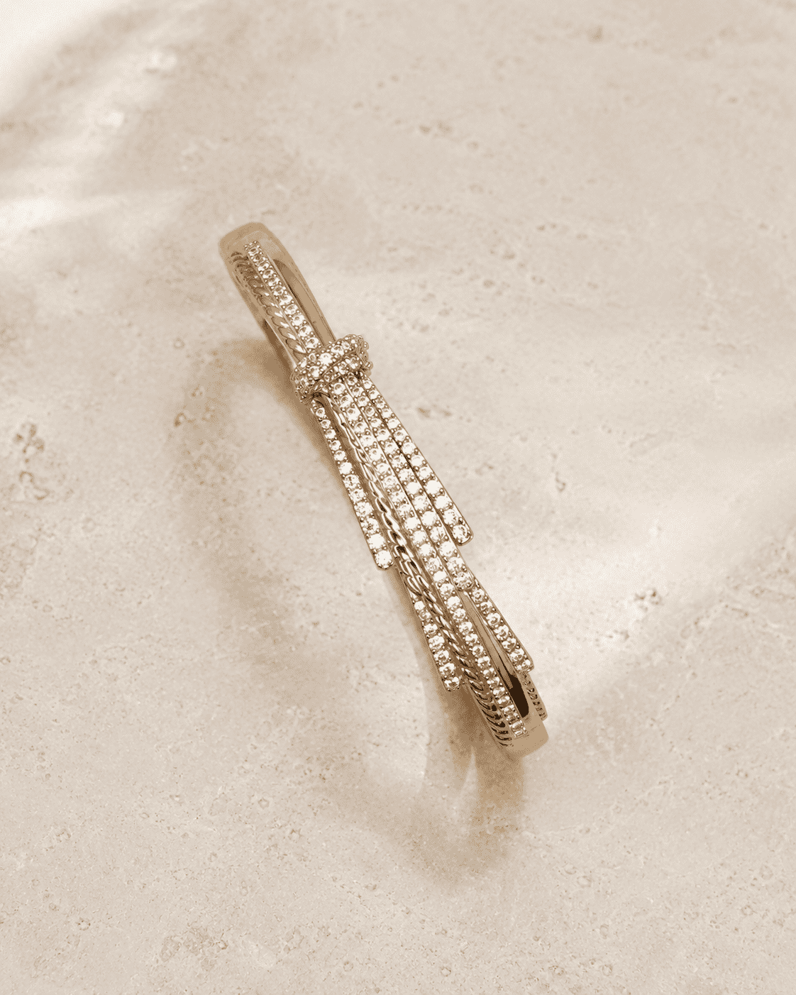 The Silk Ribbon Pavé Bangle — Gold Plated Ribbon Pavé Bangle by House of Zena, worn on model