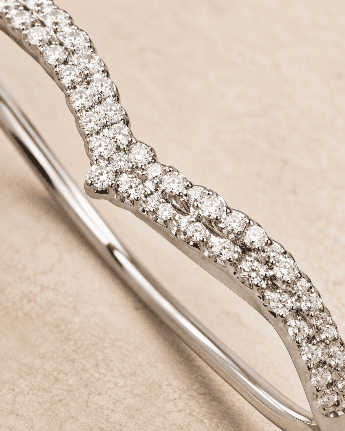The Croissant Tennis Bangle — Silver-Tone Twist Tennis Bangle by House of Zena, styled on model