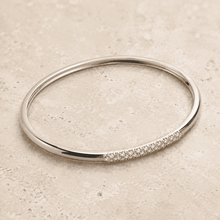 The Skinny Dip Stacking Bangle — Silver-Tone Slim Pavé Bangle by House of Zena, worn on model