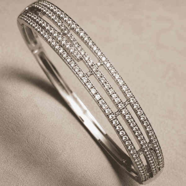 The Fast Track Triple Bangle — Gold Plated Linear Pavé Bangle by House of Zena, styled on model — Anti-Tarnish Waterproof Jewellery | House of Zena