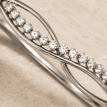 The "Forever Yours" Infinity Bangle — Silver-Tone Infinity Bangle by House of Zena, close-up detail