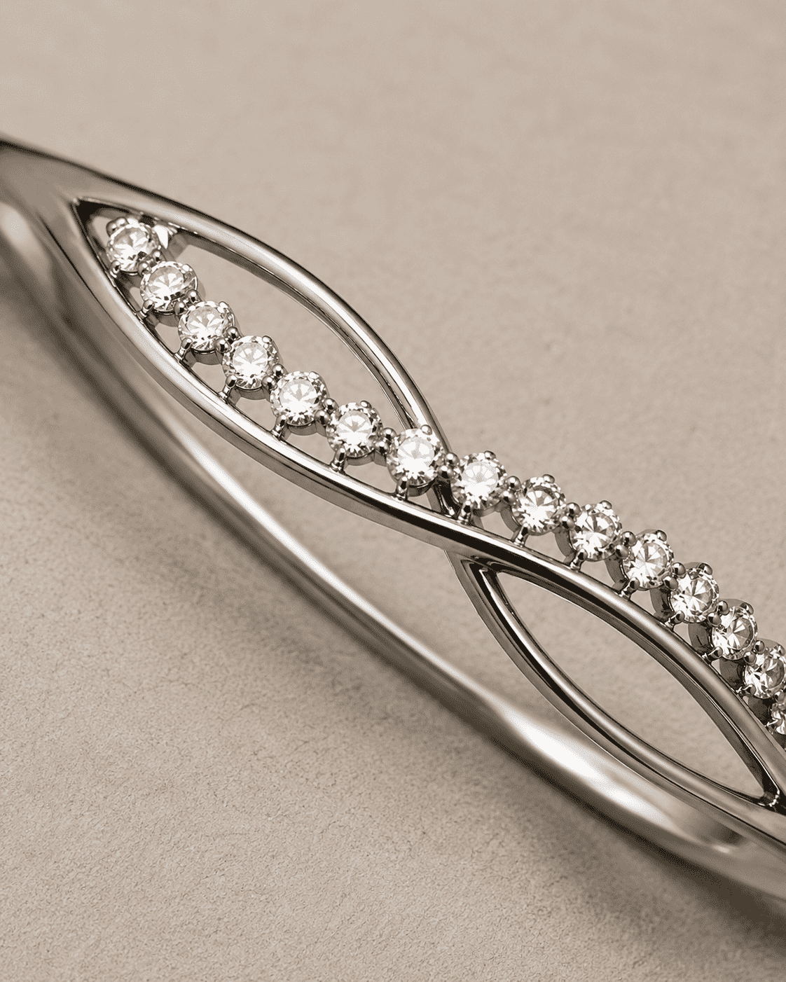 The "Forever Yours" Infinity Bangle — Silver-Tone Infinity Bangle by House of Zena, styled on model