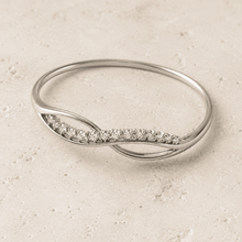The "Forever Yours" Infinity Bangle — Silver-Tone Infinity Bangle by House of Zena, worn on model