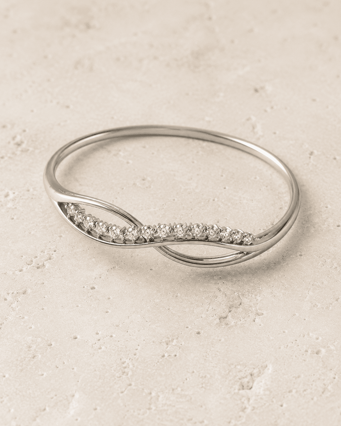 The "Forever Yours" Infinity Bangle — Silver-Tone Infinity Bangle by House of Zena, worn on model