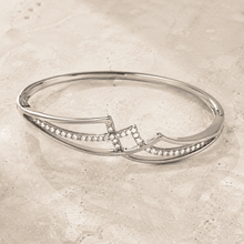 The Liquid Gold Contour Cuff — Silver-Tone Curve Bangle by House of Zena, worn on model