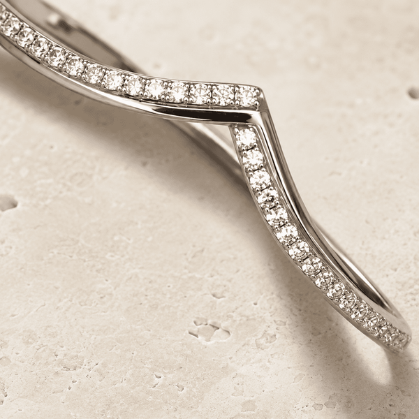 The "Kiss Me" Crisscross Bangle — Silver-Tone Twist Pavé Bangle by House of Zena, styled on model — Anti-Tarnish Waterproof Jewellery | House of Zena