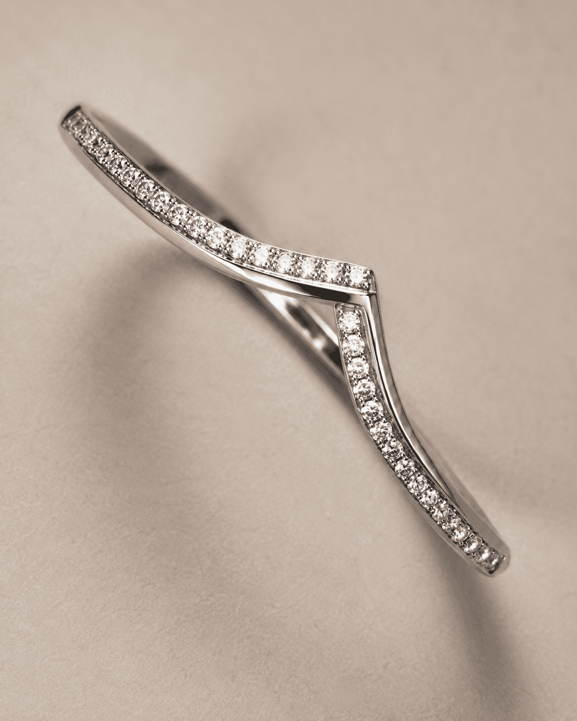 The "Kiss Me" Crisscross Bangle — Silver-Tone Twist Pavé Bangle by House of Zena, close-up detail