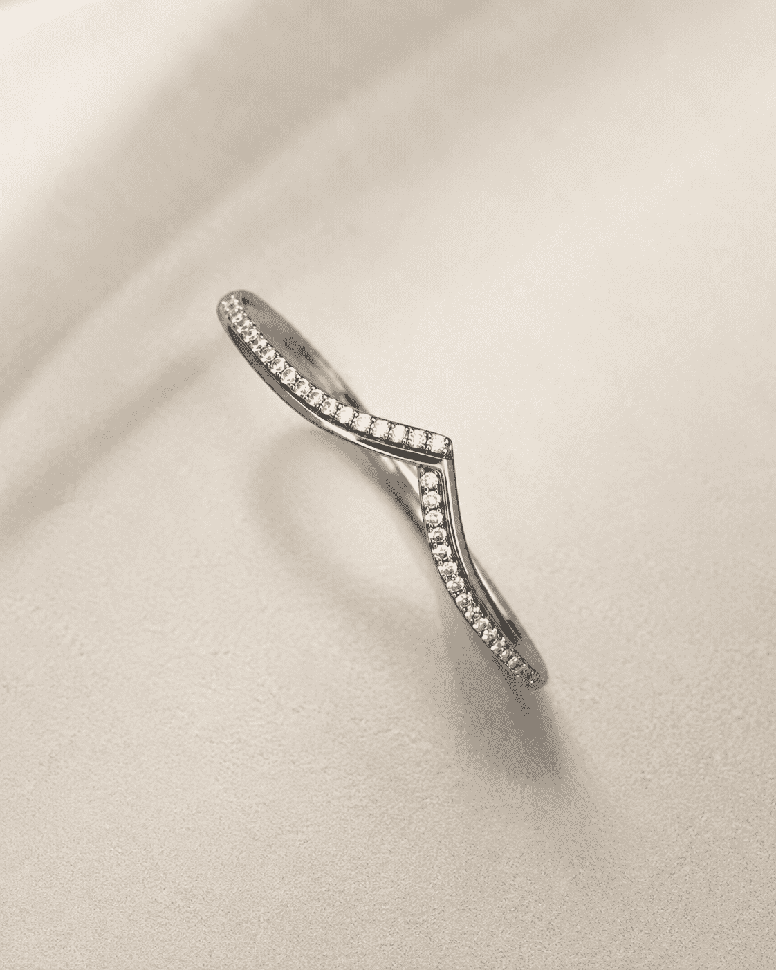 The "Kiss Me" Crisscross Bangle — Silver-Tone Twist Pavé Bangle by House of Zena, side angle