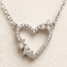 The "Wear Your Heart" Floating Pendant — Gold Plated Open Heart Necklace by House of Zena, styled on model