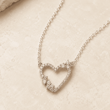 The "Wear Your Heart" Floating Pendant — Gold Plated Open Heart Necklace by House of Zena, worn on model