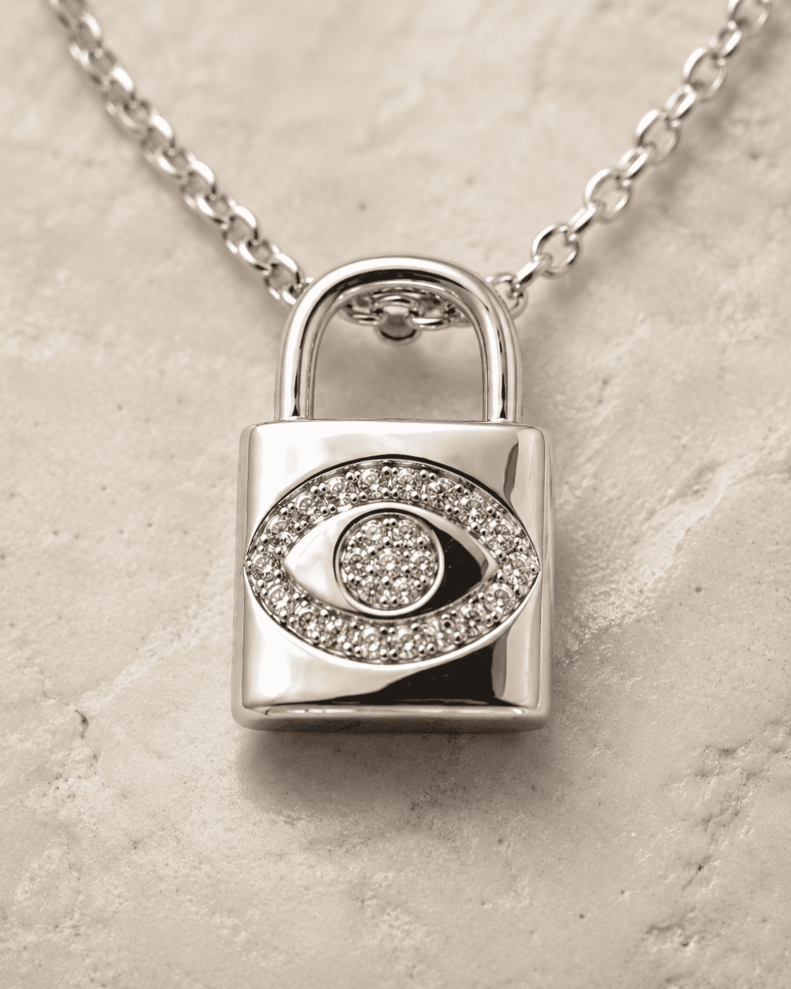 The "Mind Your Business" Padlock — Silver-Tone Lock Evil Eye Necklace by House of Zena, close-up detail