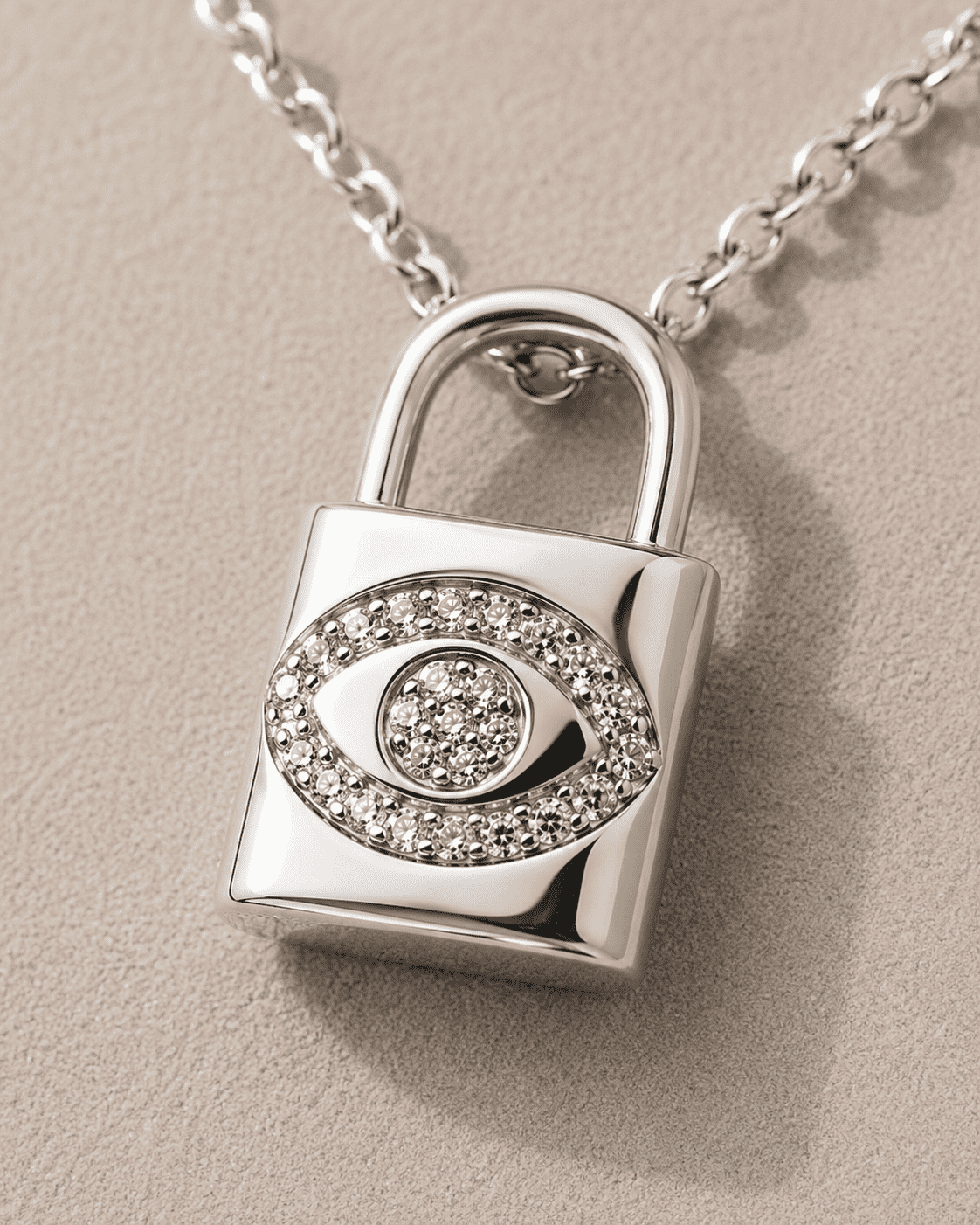 The "Mind Your Business" Padlock — Silver-Tone Lock Evil Eye Necklace by House of Zena, styled on model