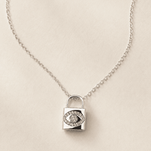 The "Mind Your Business" Padlock — Silver-Tone Lock Evil Eye Necklace by House of Zena, worn on model