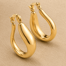 The Molten Mango Drops — Gold Plated Sculpt Hoop Earrings by House of Zena, styled on model