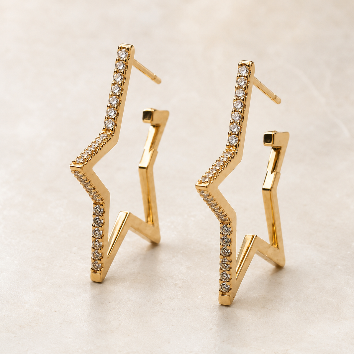 The Lucky Star Outline Hoops — Gold Plated Star Outline Hoop Earrings by House of Zena, styled on model