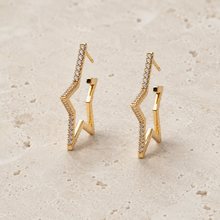 The Lucky Star Outline Hoops — Gold Plated Star Outline Hoop Earrings by House of Zena, worn on model