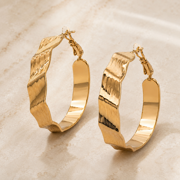 The Riviera Wave Sculpted Hoops — Gold Plated Wave Hoop Earrings by House of Zena, styled on model — Anti-Tarnish Waterproof Jewellery | House of Zena