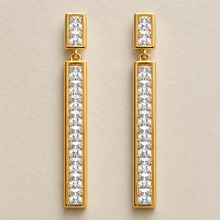 The Champagne Flute Drops — Gold Plated Line Drop Earrings by House of Zena, worn on model