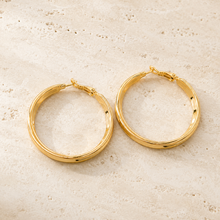 The Butter Croissant Hoops — Gold Plated Classic Hoop Earrings by House of Zena, worn on model