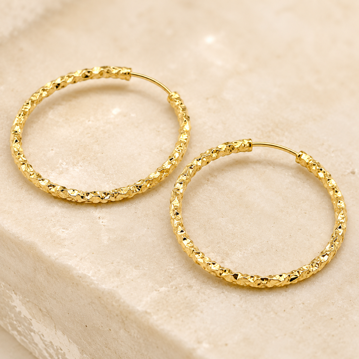 The Churro Ribbed Hoops — Gold Plated Textured Hoop Earrings by House of Zena, worn on model