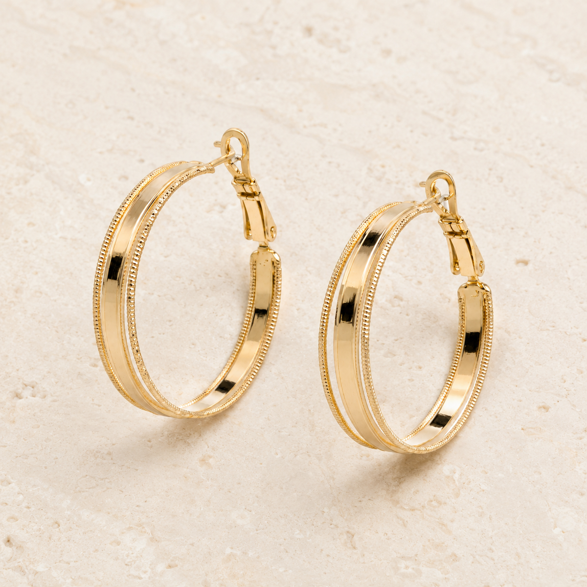 The Roman Column Hoops — Gold Plated Ridge Hoop Earrings by House of Zena, worn on model
