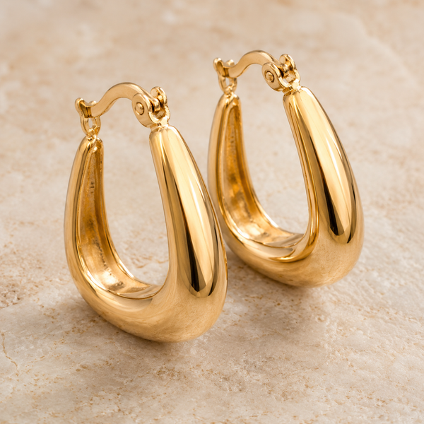The Bottega Sculpted Domes — Gold Plated Teardrop Hoop Earrings by House of Zena, styled on model — Anti-Tarnish Waterproof Jewellery | House of Zena
