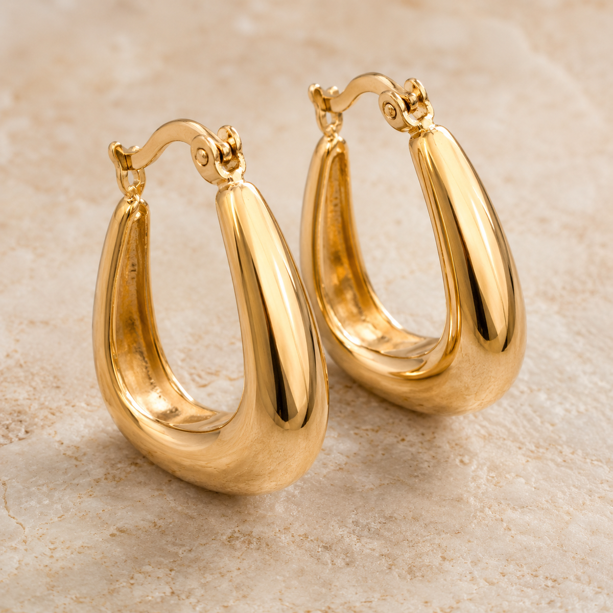 The Bottega Sculpted Domes — Gold Plated Teardrop Hoop Earrings by House of Zena, styled on model