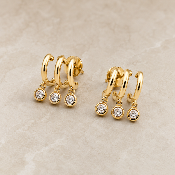 The Three Wishes Charm Hoops — Gold Plated Triple Charm Hoop Earrings by House of Zena, styled on model — Anti-Tarnish Waterproof Jewellery | House of Zena