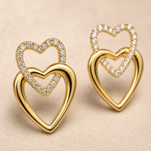The First Crush Twin Hearts — Gold Plated Twin Heart Earrings by House of Zena, styled on model
