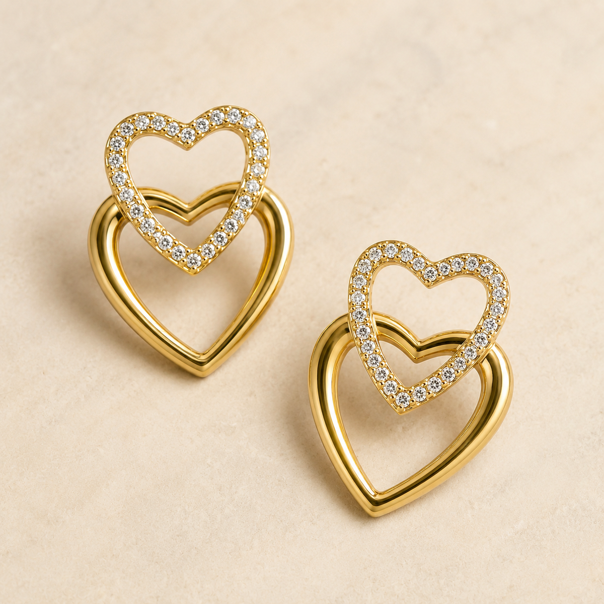 The First Crush Twin Hearts — Gold Plated Twin Heart Earrings by House of Zena, close-up detail