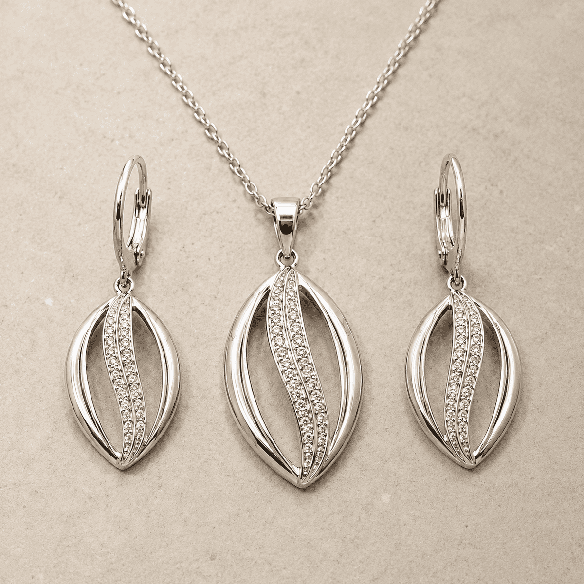 The Melted Honeycomb Set — Gold Plated Wave Pendant Set by House of Zena, styled on model