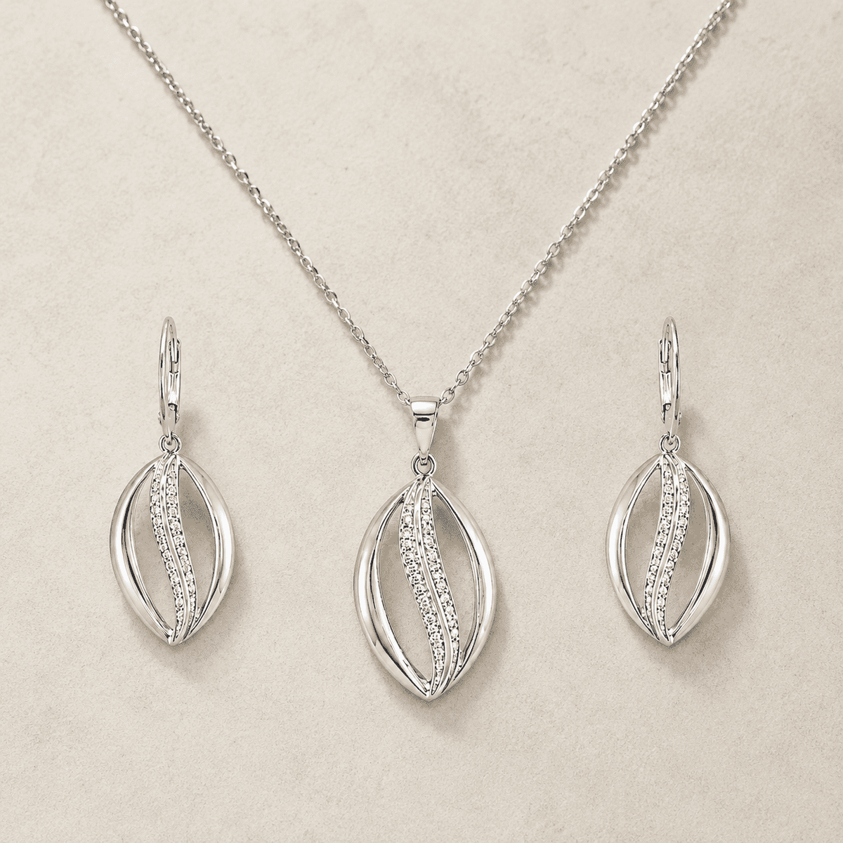 The Melted Honeycomb Set — Gold Plated Wave Pendant Set by House of Zena, side angle