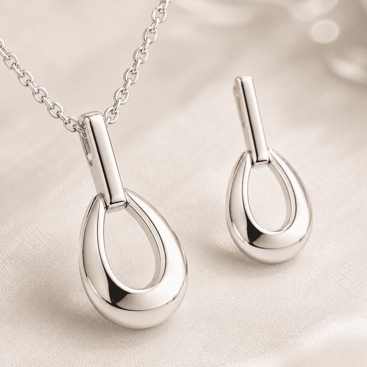 The Happy Tears Solitaire Set — Gold Plated Évara Drop Pendant Set by House of Zena, styled on model